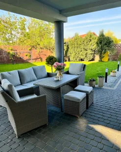 FONTI 5 personers Loungesæt med bord og fodskammel Brungrå PE-rattan med puder
